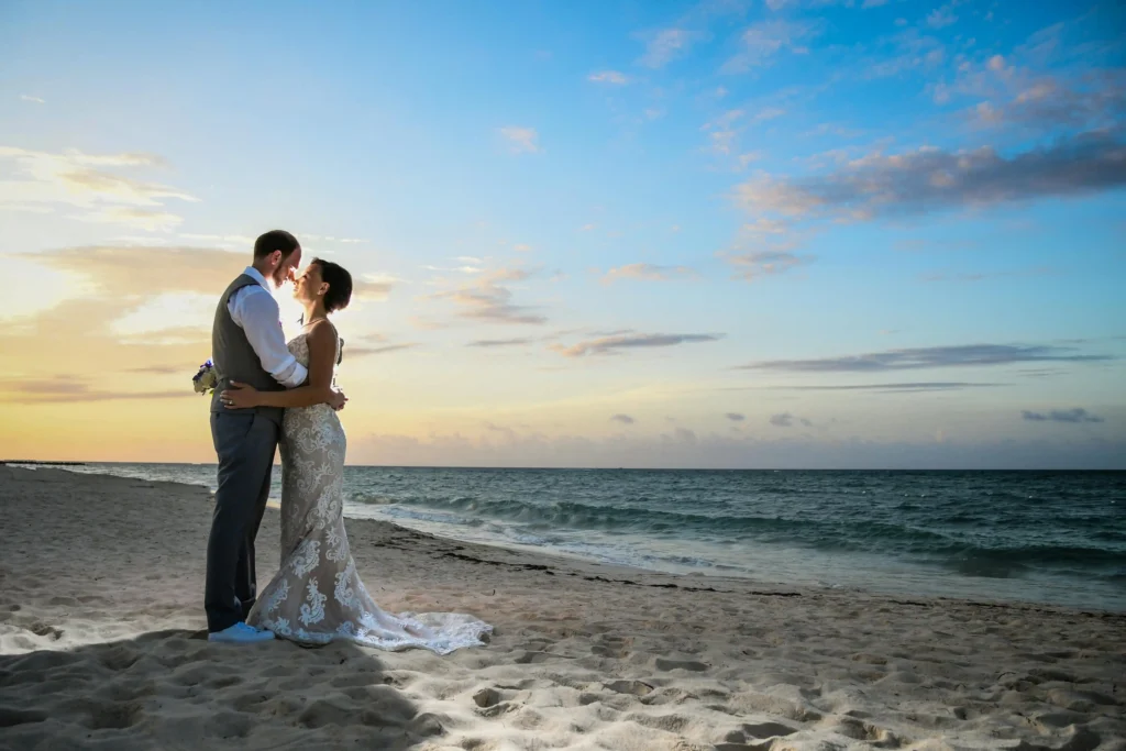 couple hugging on wedding at beach 