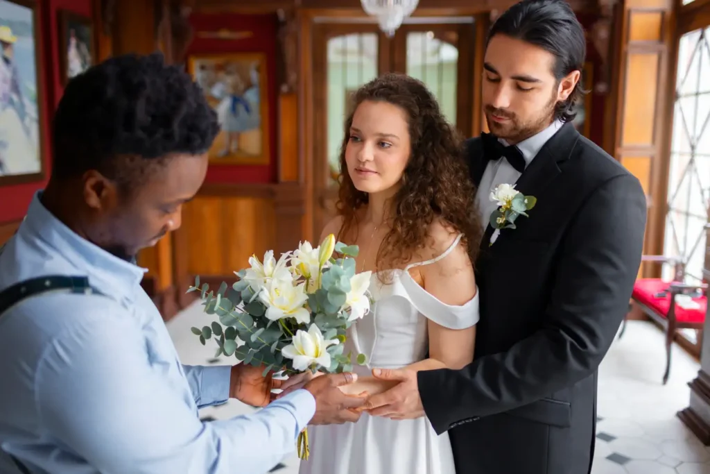 wedding usher with wedding couple